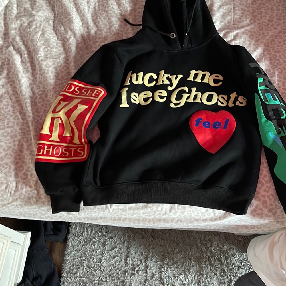 kanye west hoodie size large in great condition, barely worn fits as a medium